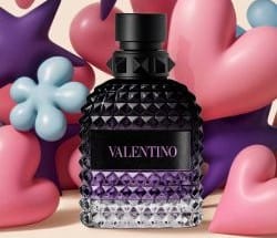 Trzy flakony perfum męskich Valentino Uomo Born in Roma na tle w paski